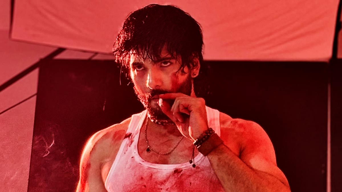 Nepali actor Sushil Shrestha in an intense action look from the movie Pariwartan, covered in sweat and blood during a dramatic scene.